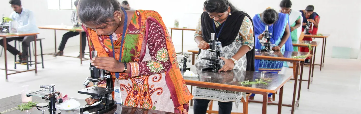 Students using microscopes in a life sciences lab
