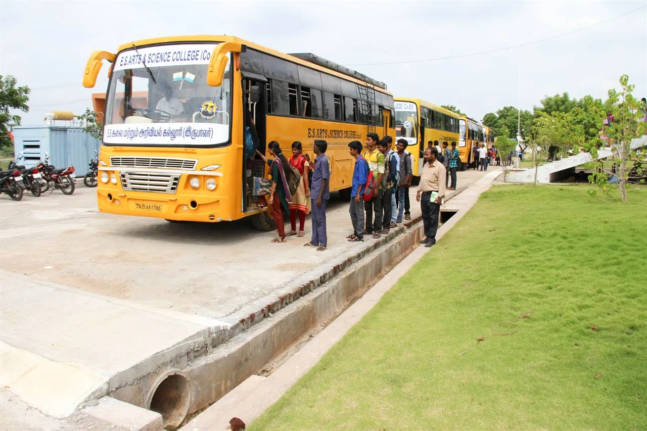 Students boarding the yellow college buses on campus