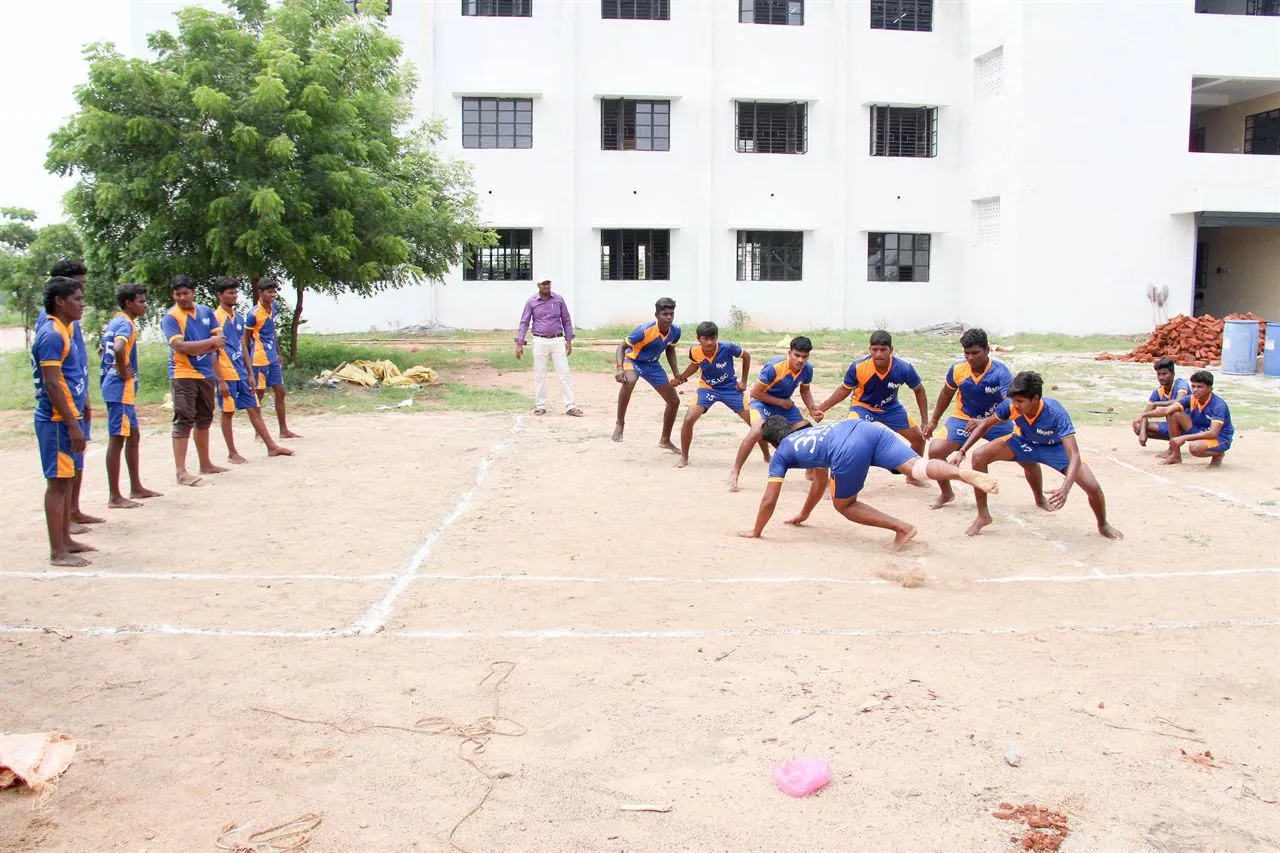 Students playing kabaddi on the college ground